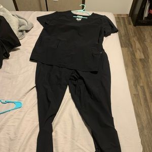 Black Greys Anatomy Edge scrubs.